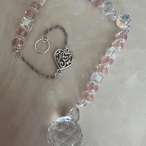 Celebrate October birthstone with this Suncatcher. Beautiful Pink Tourmaline crystal beads sparkle when the sun hits them. Great gift idea.